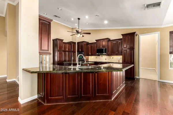 a view of a swimming pool with a table and chairs