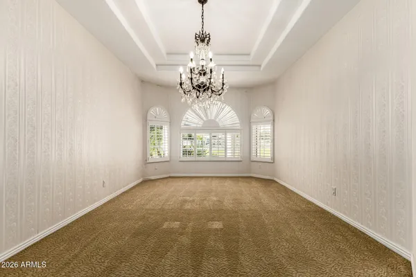 a kitchen with kitchen island granite countertop wooden floors and a sink
