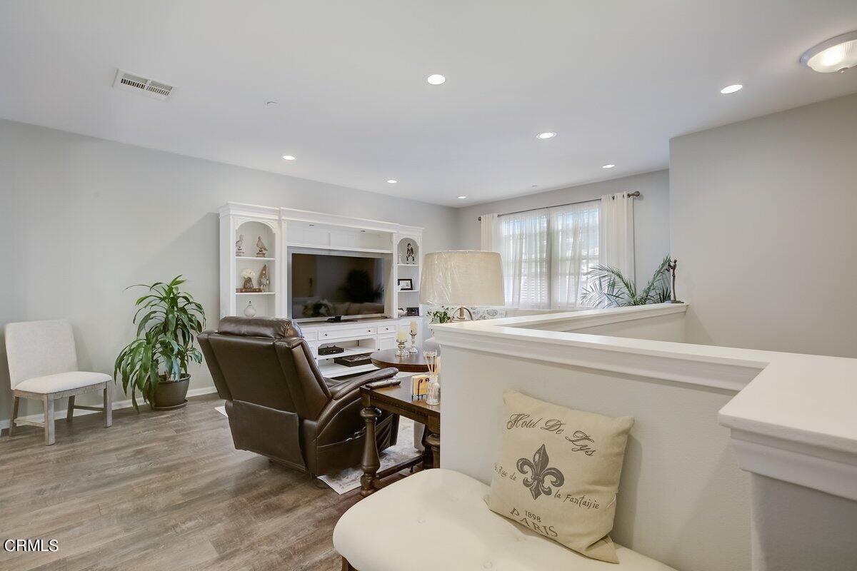3654 Islander Walk Oxnard, CA 93035 - Photo 12 of 61 a living room with furniture and a flat screen tv