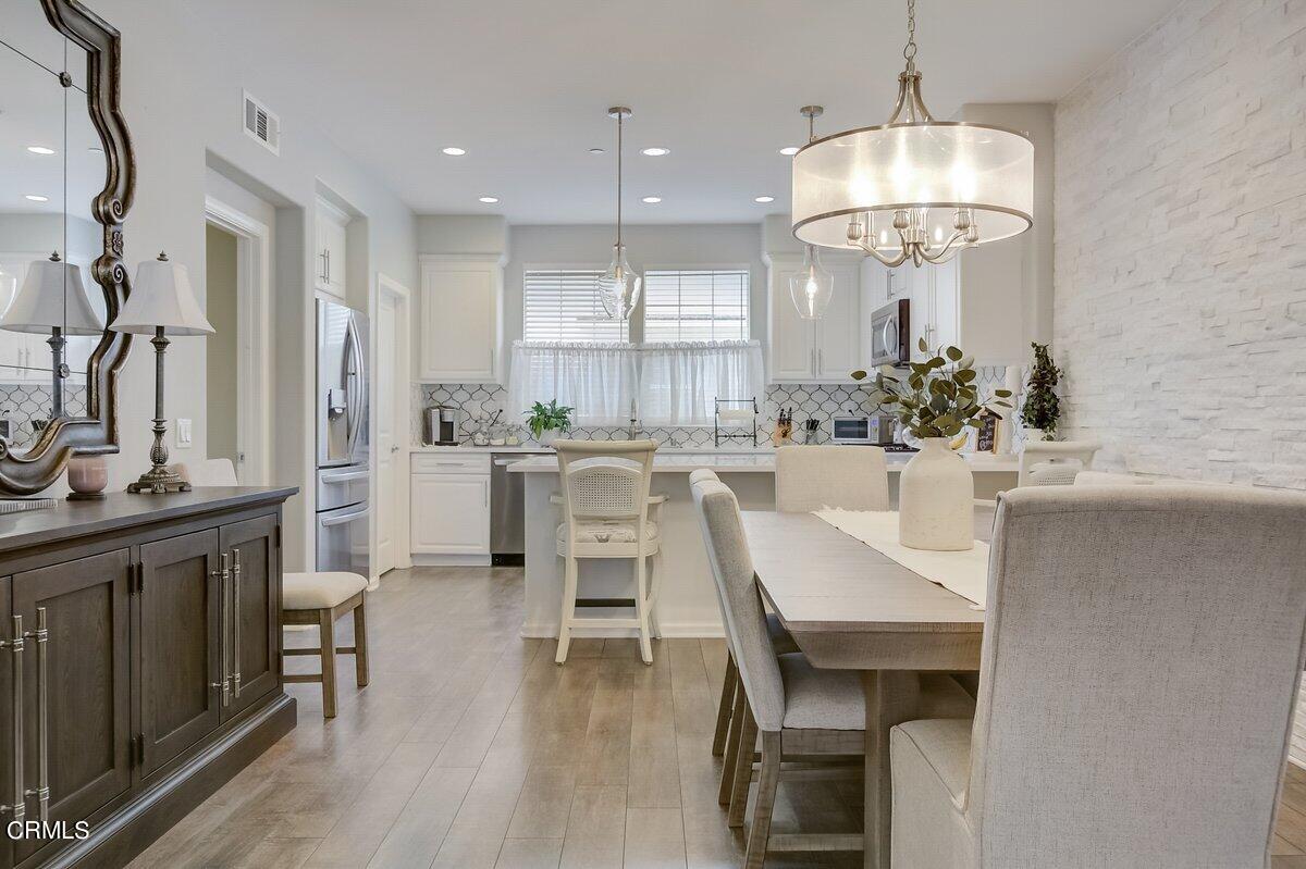 3654 Islander Walk Oxnard, CA 93035 - Photo 13 of 61 a large kitchen with a table and chairs