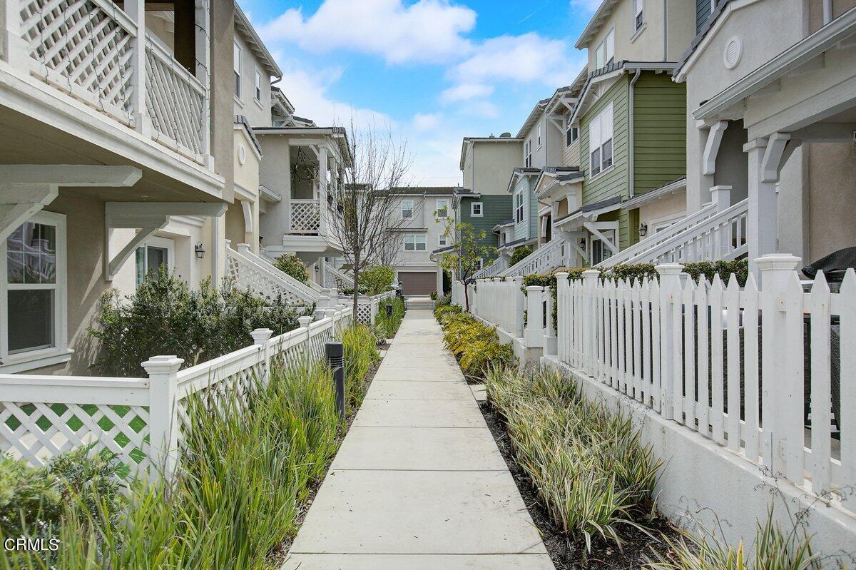 3654 Islander Walk Oxnard, CA 93035 - Photo 2 of 61 a view of a house with entrance stairs and a garden