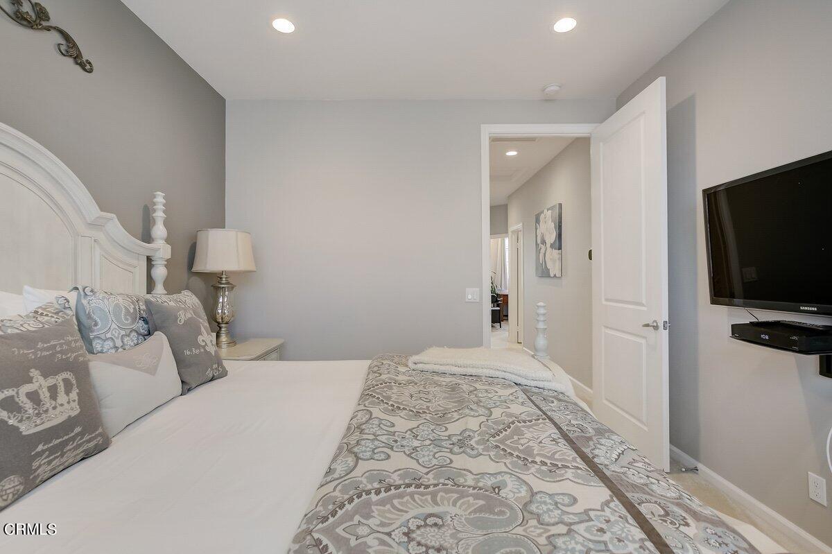 3654 Islander Walk Oxnard, CA 93035 - Photo 29 of 61 a bedroom with a bed and a flat screen tv