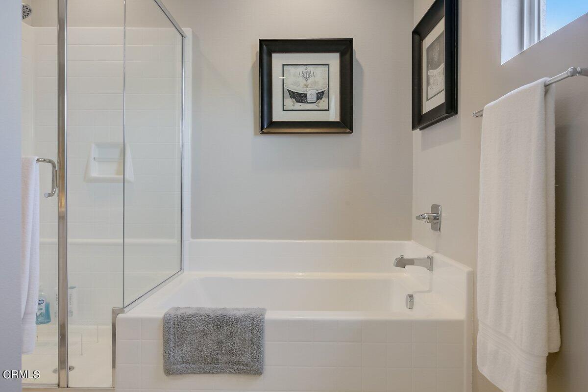 3654 Islander Walk Oxnard, CA 93035 - Photo 30 of 61 a bathroom with a bathtub and a shower