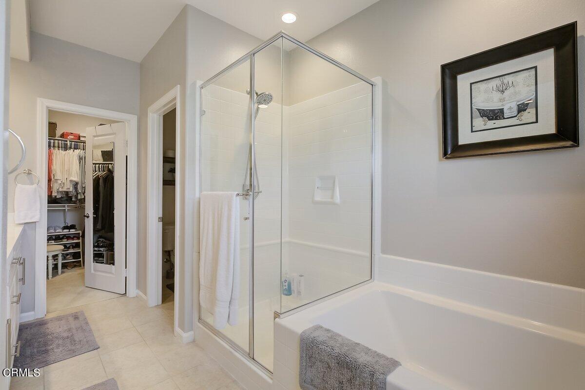 3654 Islander Walk Oxnard, CA 93035 - Photo 31 of 61 a bathroom with a shower and a glass door shower
