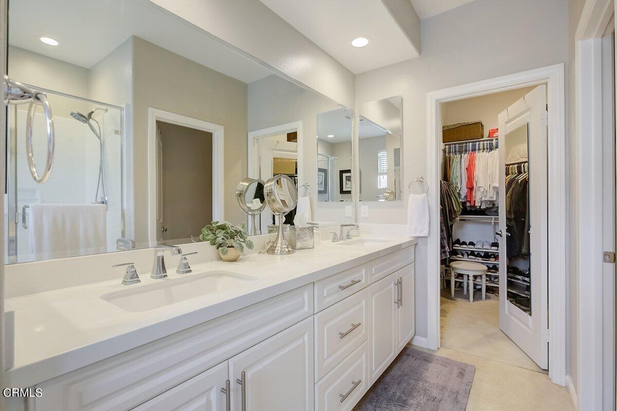 3654 Islander Walk Oxnard, CA 93035 - Photo 32 of 61 a spacious bathroom with a double vanity sink mirror and double