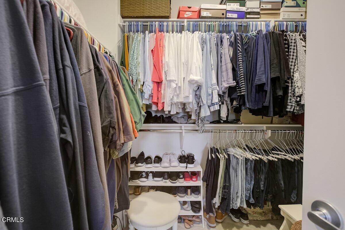 3654 Islander Walk Oxnard, CA 93035 - Photo 34 of 61 a view of walk in closet with clothes and shoes