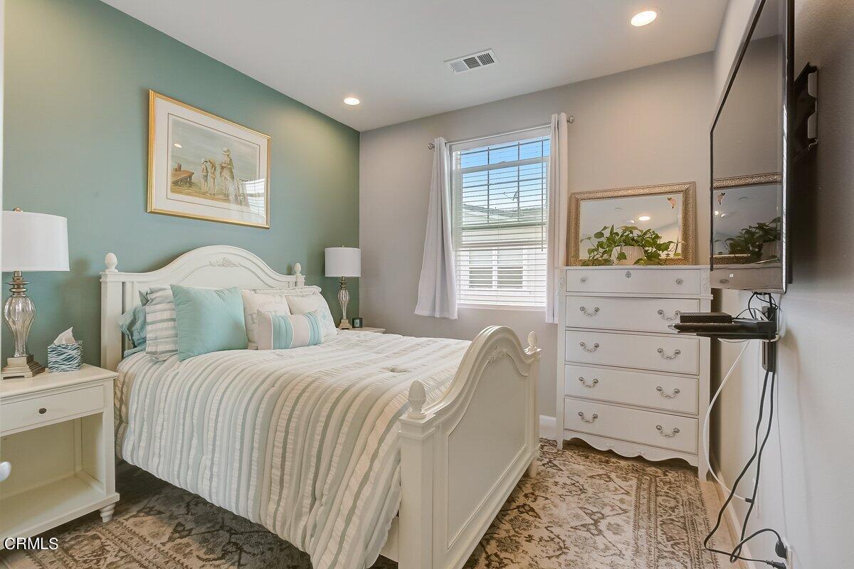 3654 Islander Walk Oxnard, CA 93035 - Photo 35 of 61 a bedroom with a bed and a dresser