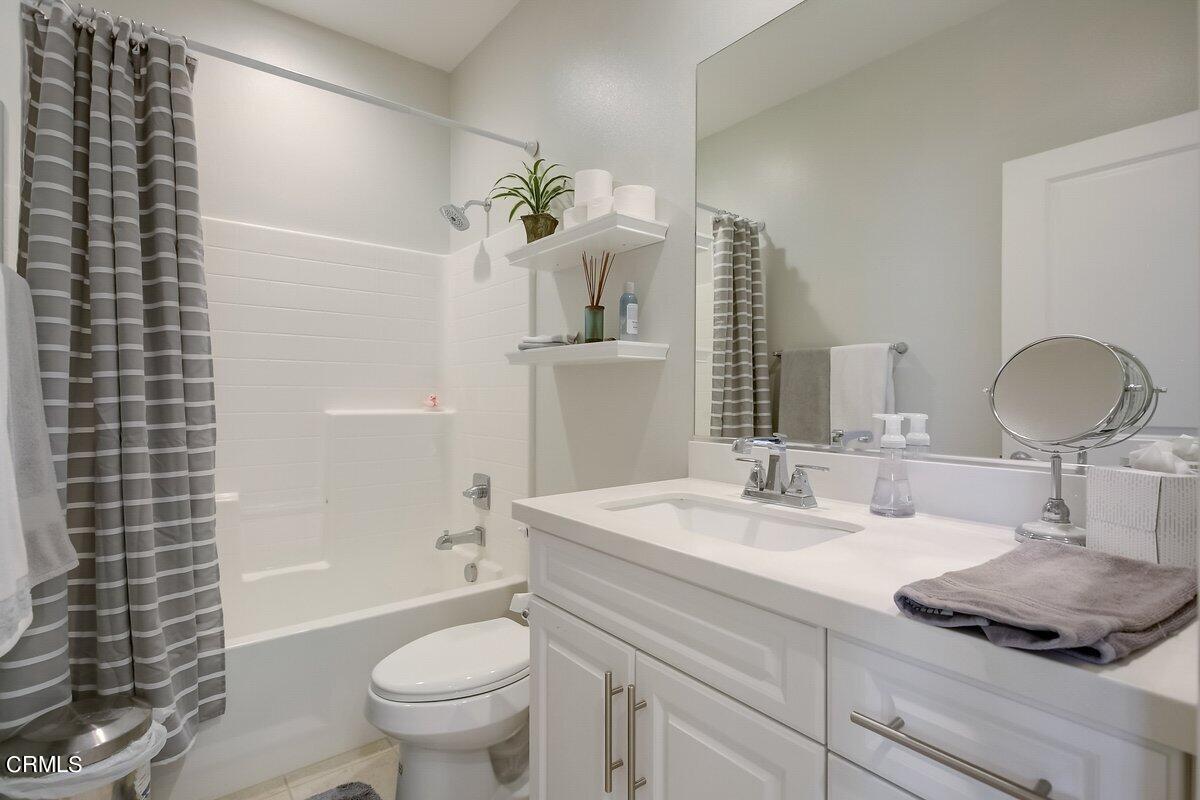 3654 Islander Walk Oxnard, CA 93035 - Photo 38 of 61 a bathroom with a sink toilet and shower