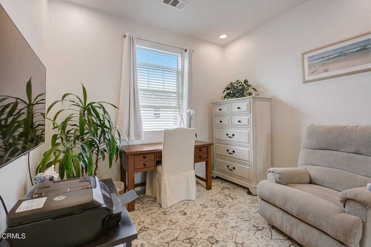 3654 Islander Walk Oxnard, CA 93035 - Photo 39 of 61 a living room with furniture and a potted plant