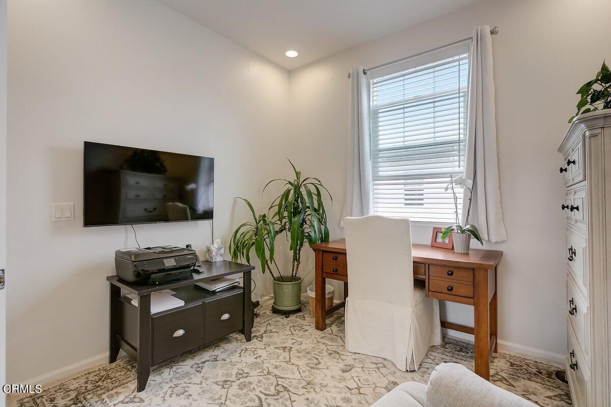 3654 Islander Walk Oxnard, CA 93035 - Photo 40 of 61 a living room with furniture and a flat screen tv