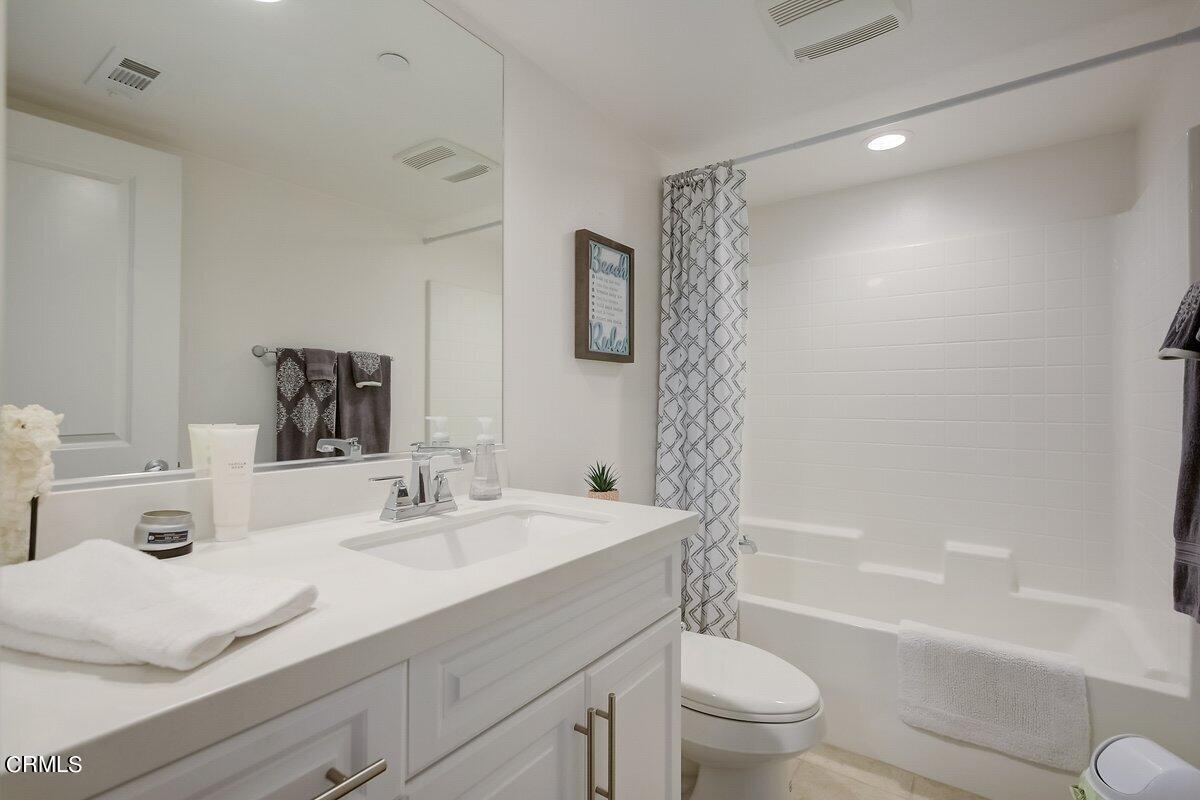 3654 Islander Walk Oxnard, CA 93035 - Photo 47 of 61 a bathroom with a sink a toilet and shower