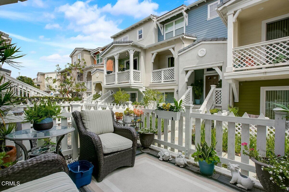 3654 Islander Walk Oxnard, CA 93035 - Photo 49 of 61 a view of a patio with couches table and chairs and potted plants