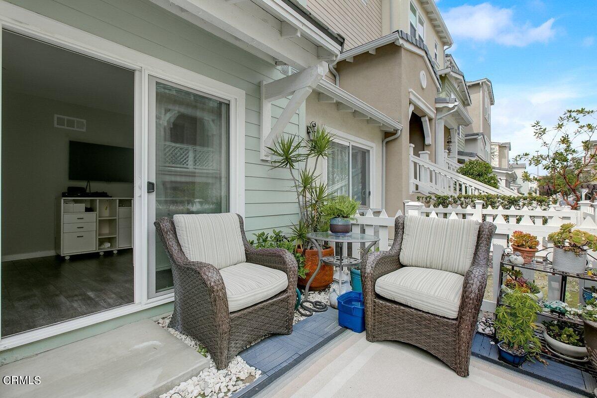 3654 Islander Walk Oxnard, CA 93035 - Photo 50 of 61 a view of a patio with couches table and chairs and potted plants