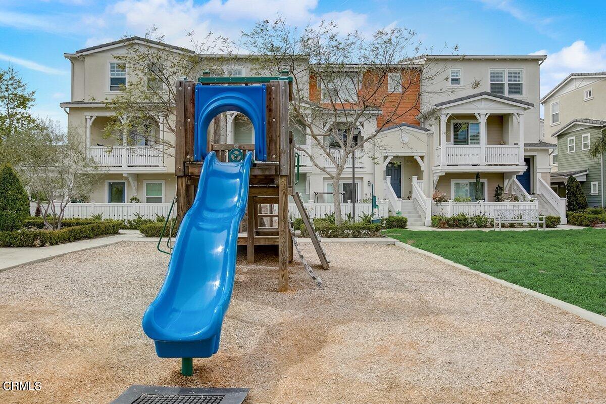 3654 Islander Walk Oxnard, CA 93035 - Photo 54 of 61 a front view of a house with garden