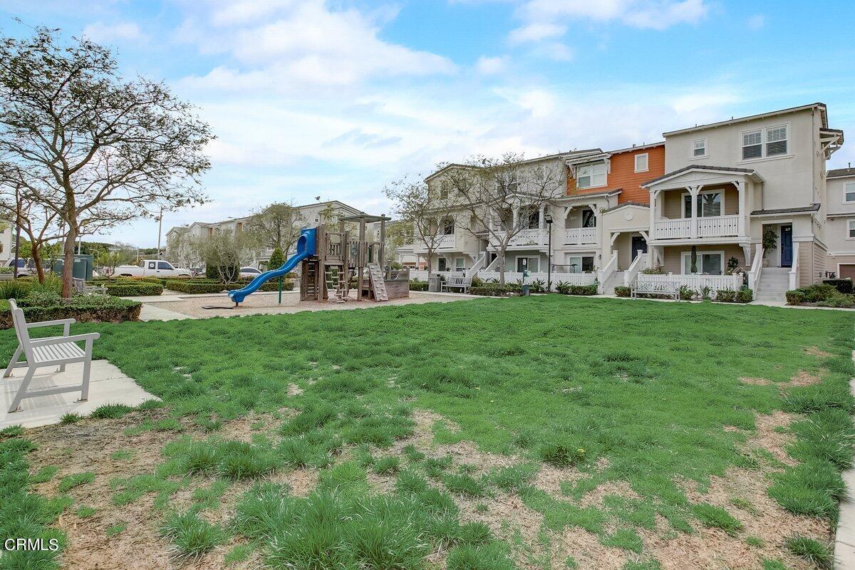 3654 Islander Walk Oxnard, CA 93035 - Photo 55 of 61 a view of a building with a yard