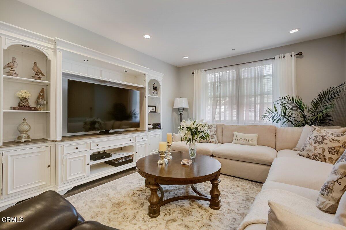 3654 Islander Walk Oxnard, CA 93035 - Photo 7 of 61 a living room with furniture and a flat screen tv
