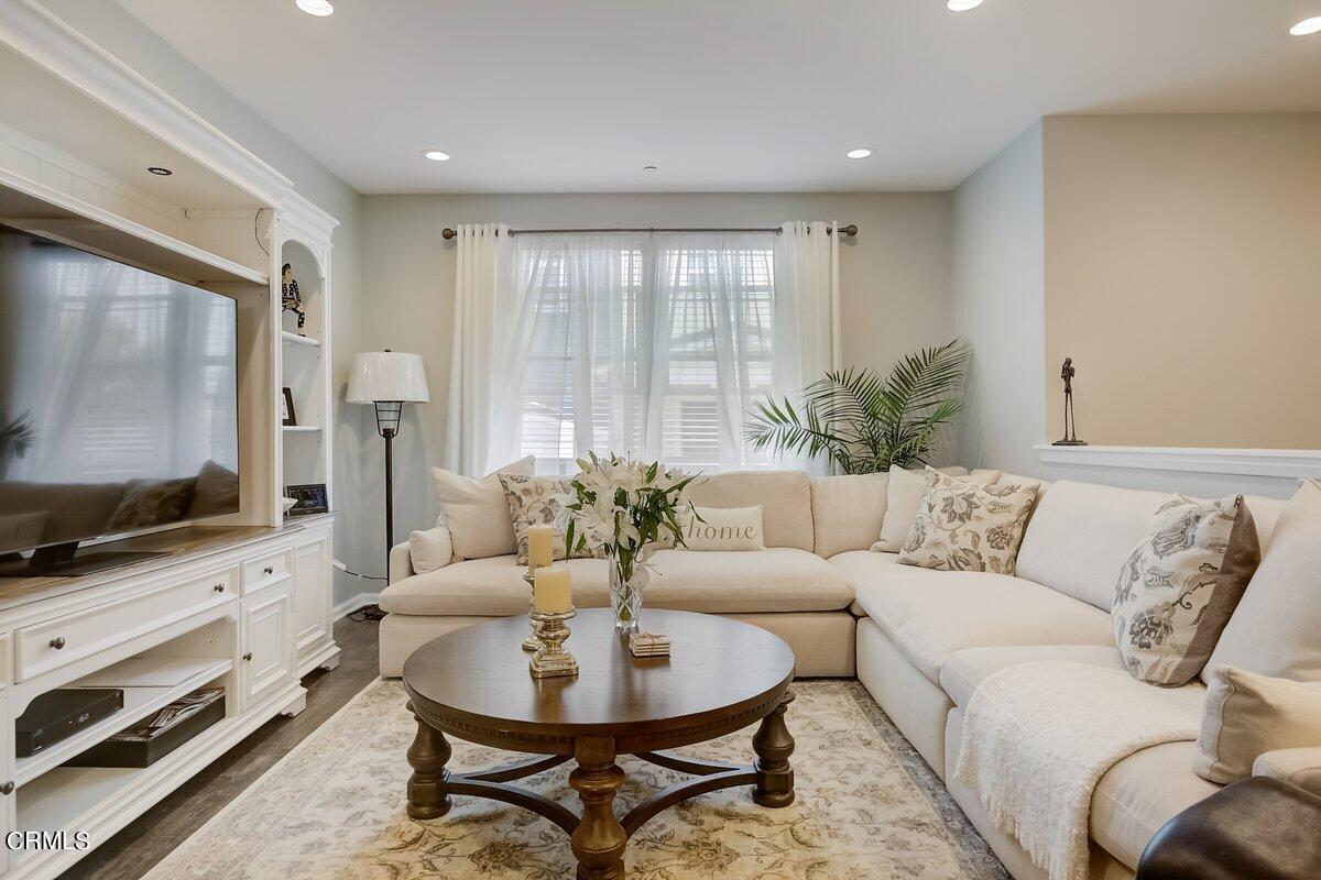 3654 Islander Walk Oxnard, CA 93035 - Photo 8 of 61 a living room with furniture and a flat screen tv