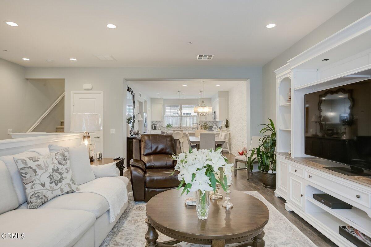 3654 Islander Walk Oxnard, CA 93035 - Photo 10 of 61 a living room with furniture and a flat screen tv