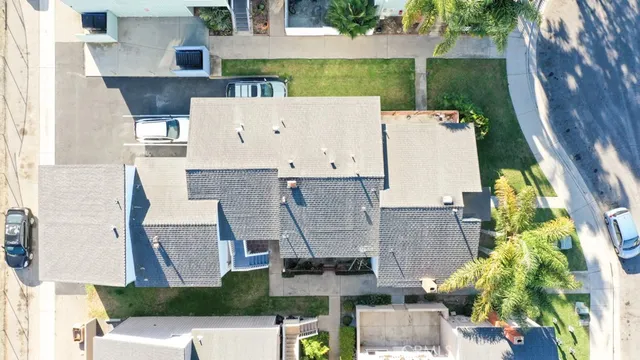 an aerial view of residential houses with outdoor space