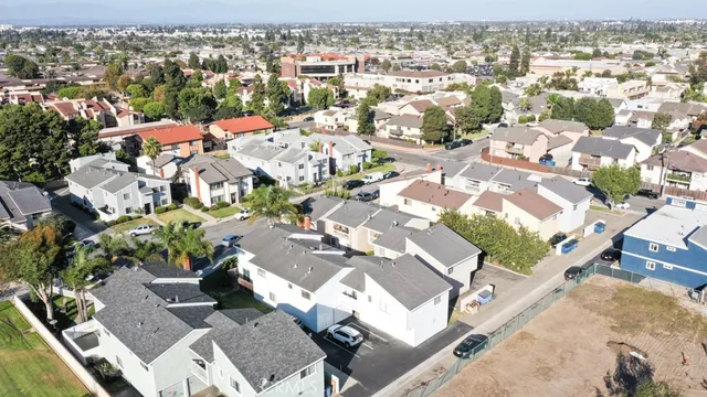 an aerial view of residential houses with outdoor space