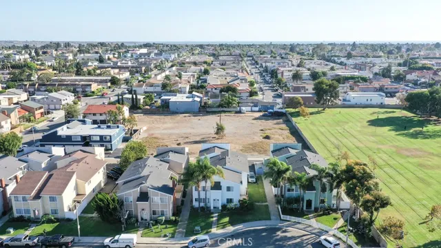 an aerial view of a city with lots of residential buildings
