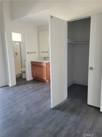 an empty room with a wooden door