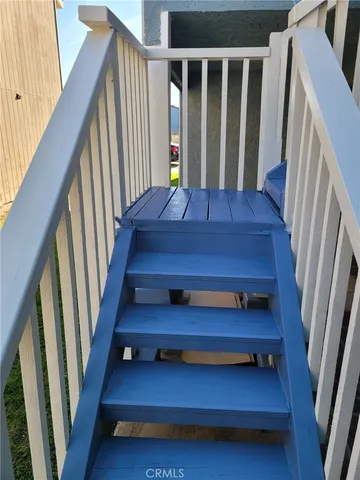 a view of staircase with wooden floor and stairs
