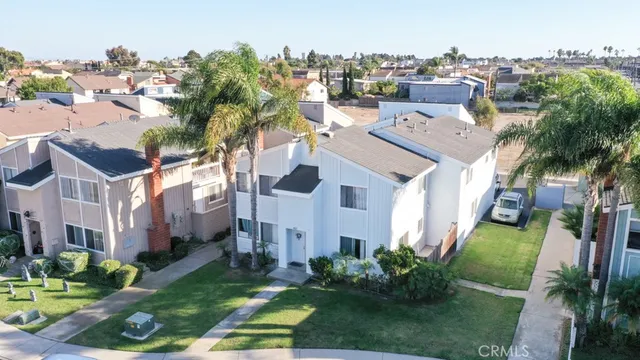 a aerial view of a house with a yard