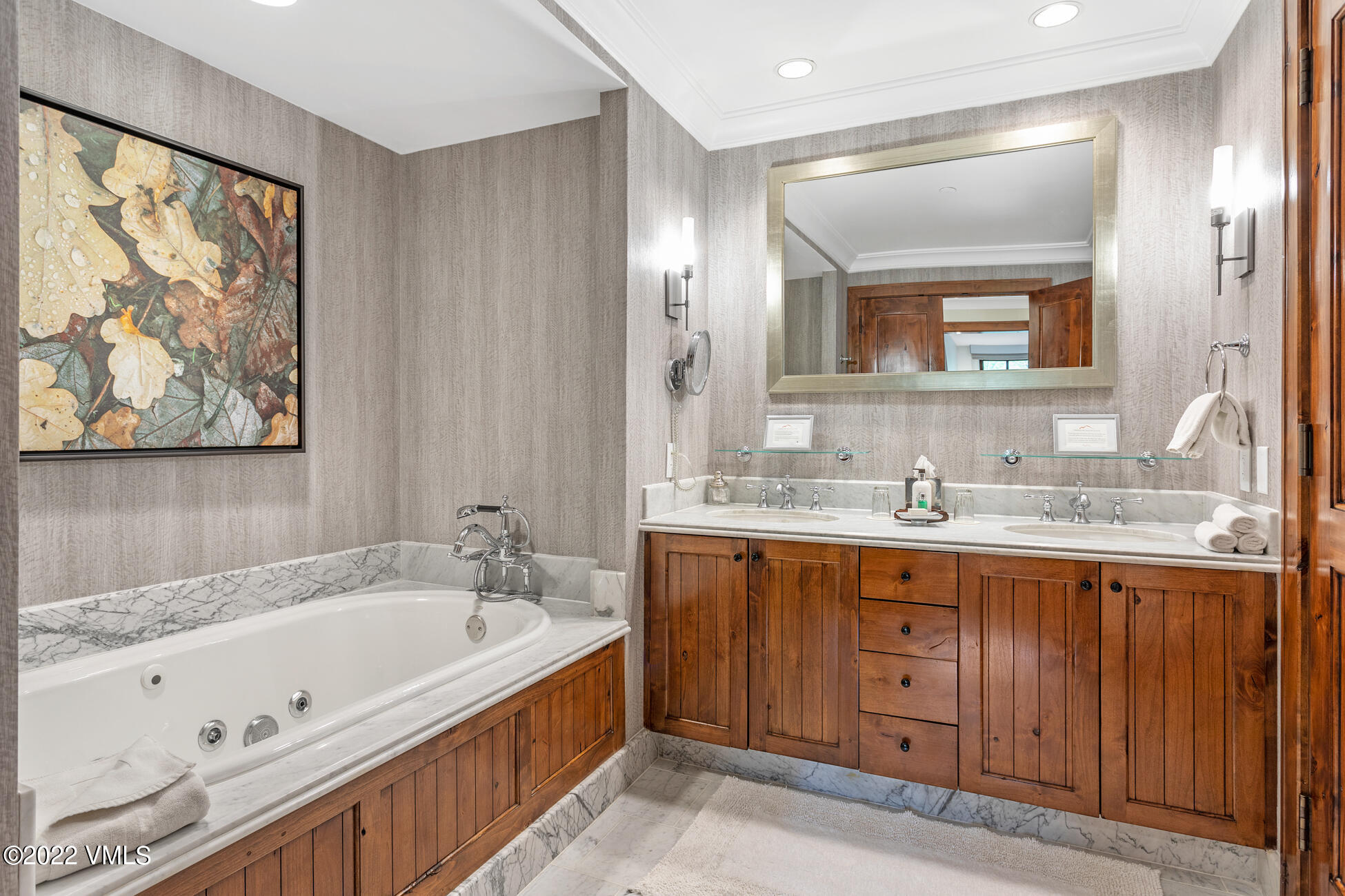 100 Bachelor Ridge Road, Unit 3304 Avon, CO 81620 - Photo 25 of 54 a bathroom with a granite countertop tub sink and mirror
