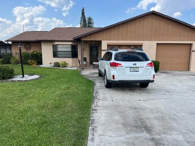 a car parked in front of a house