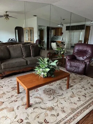 a living room with furniture a couch and a fireplace