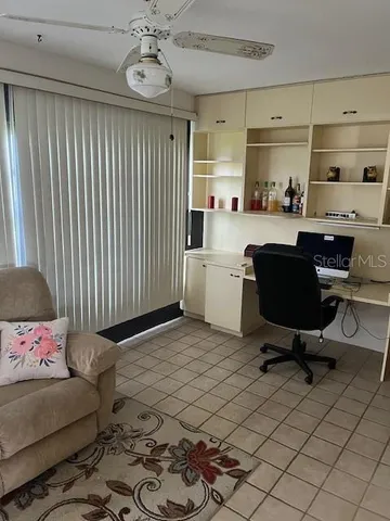 a workspace with furniture and a window