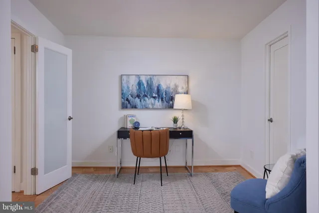 a living room with furniture and a rug