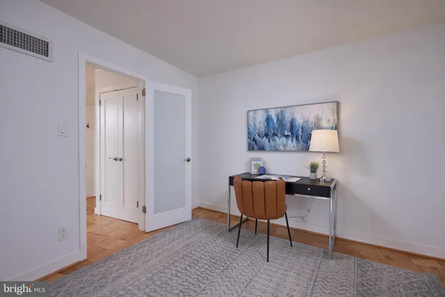 a livingroom with a workspace