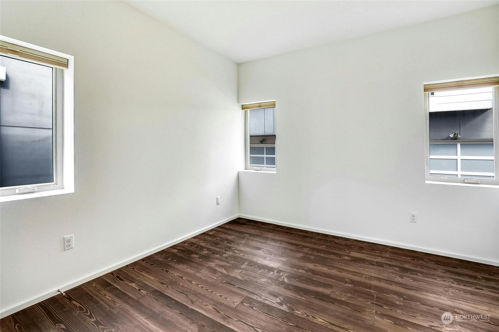 4404 Renton Avenue South Seattle, WA 98108 - Photo 23 of 25 a view of an empty room with wooden floor and a window