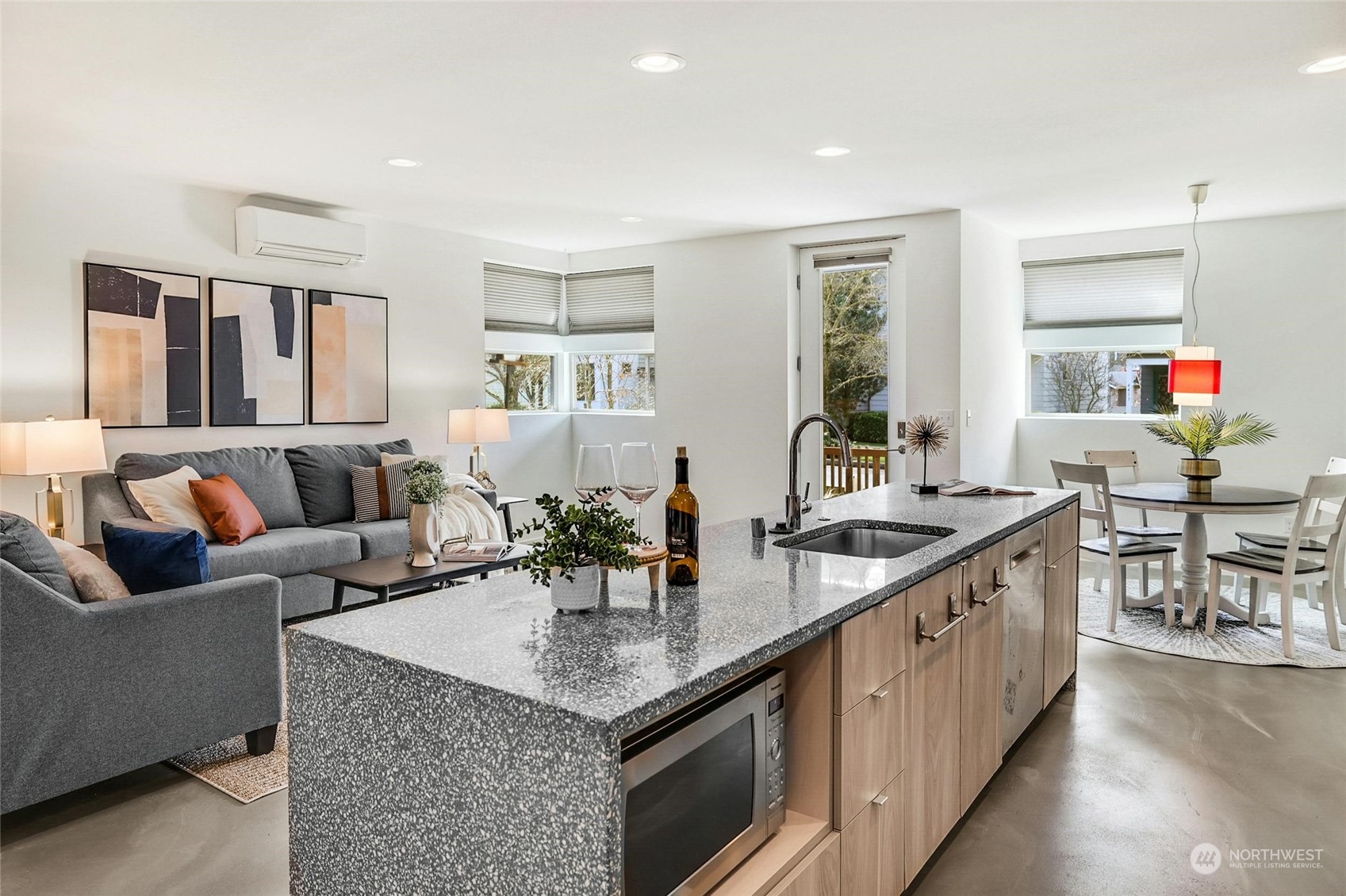 4404 Renton Avenue South Seattle, WA 98108 - Photo 7 of 25 a kitchen with granite countertop a table and chairs