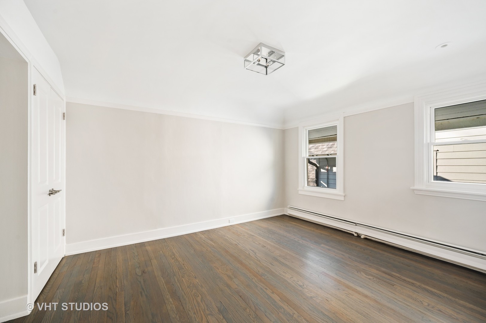 632 Abbotsford Road Kenilworth, IL 60043 - Photo 16 of 30 an empty room with wooden floor and windows