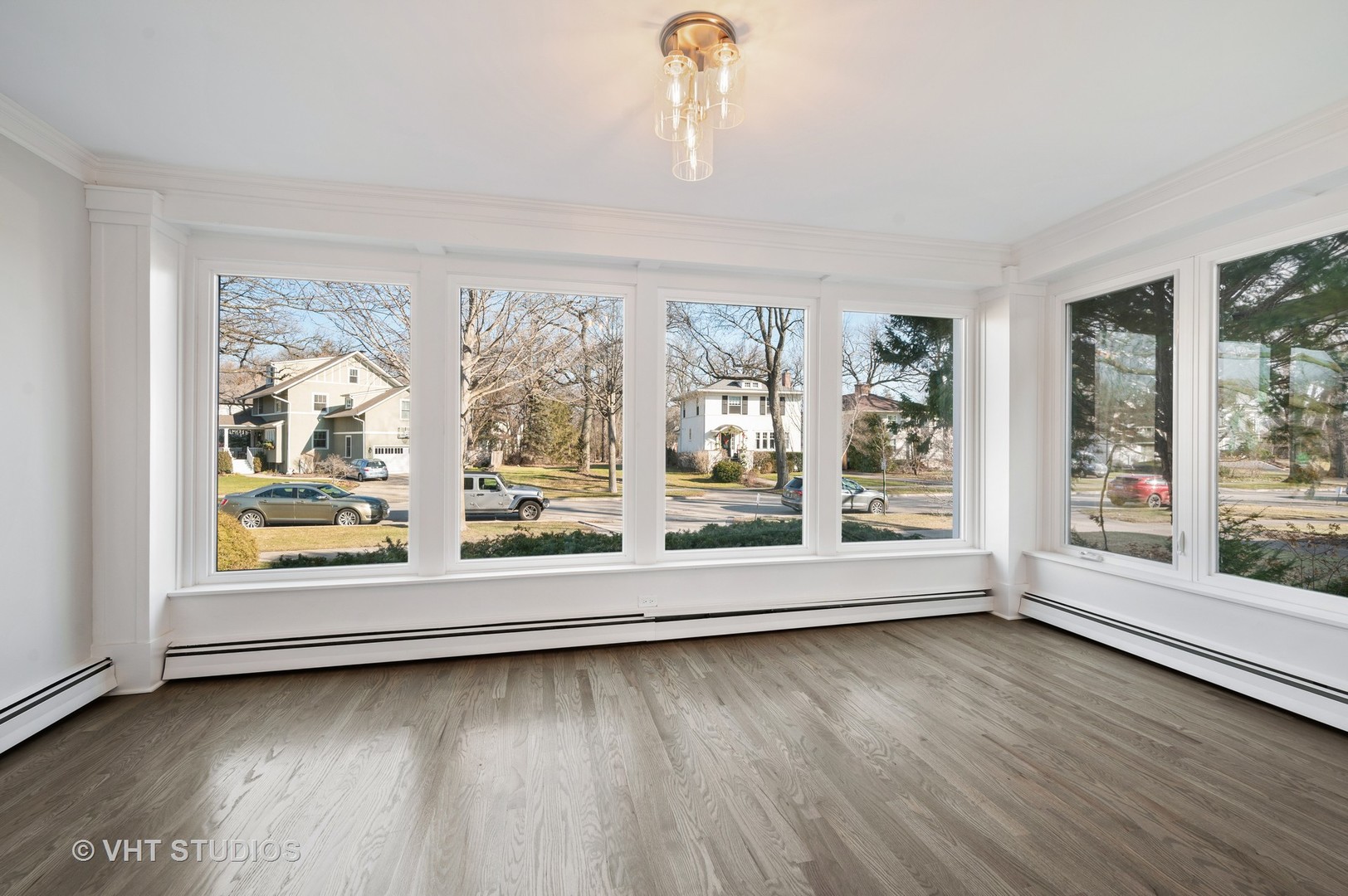 632 Abbotsford Road Kenilworth, IL 60043 - Photo 5 of 30 an empty room with wooden floor and windows