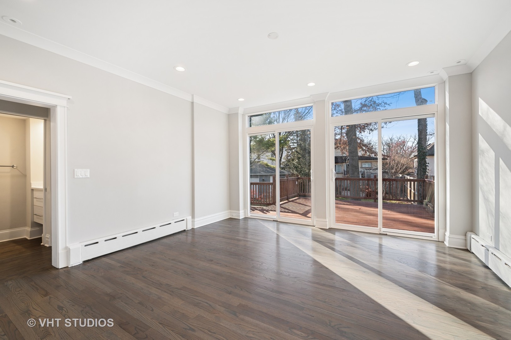 632 Abbotsford Road Kenilworth, IL 60043 - Photo 7 of 30 an empty room with wooden floor and windows