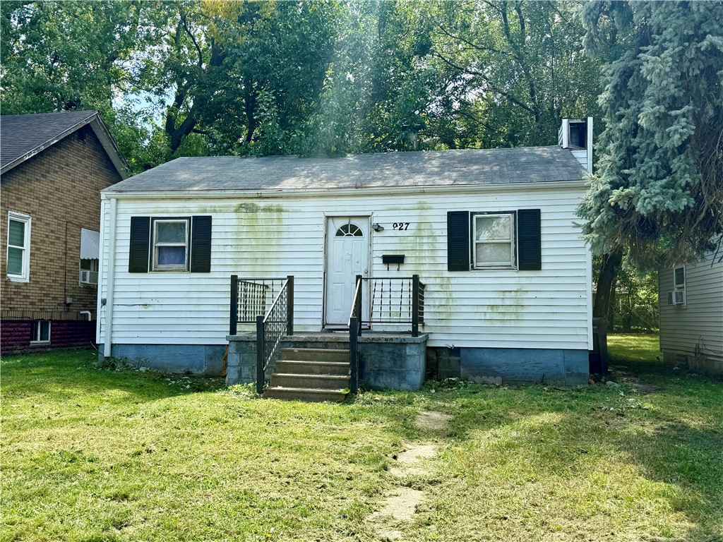 927 East Harrison Avenue Decatur, IL 62526 - Photo 2 of 3 a view of a house with a yard