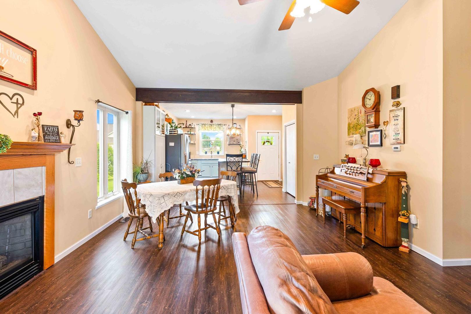 107 Labrador Lane Downs, IL 61736 - Photo 14 of 35 a view of a dining room with furniture window and wooden floor
