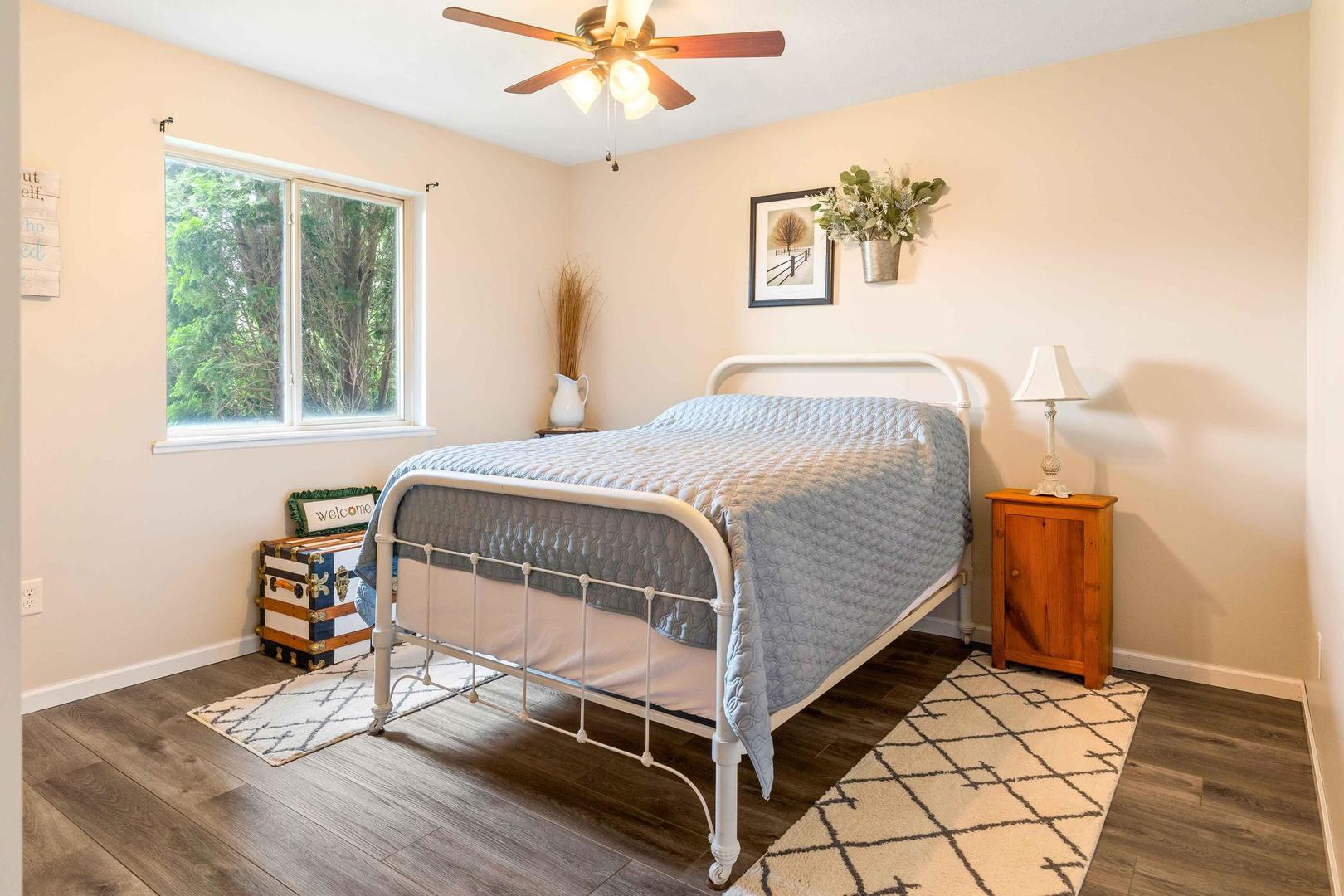 107 Labrador Lane Downs, IL 61736 - Photo 17 of 35 a bedroom with a bed and a chandelier