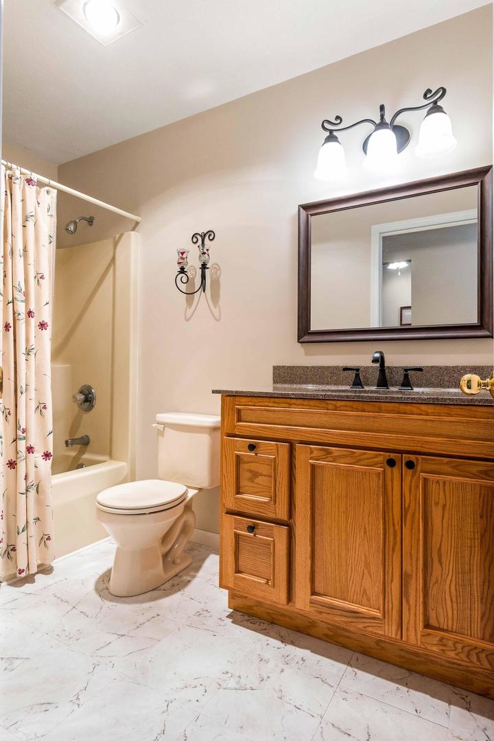 107 Labrador Lane Downs, IL 61736 - Photo 19 of 35 a bathroom with a toilet sink and mirror