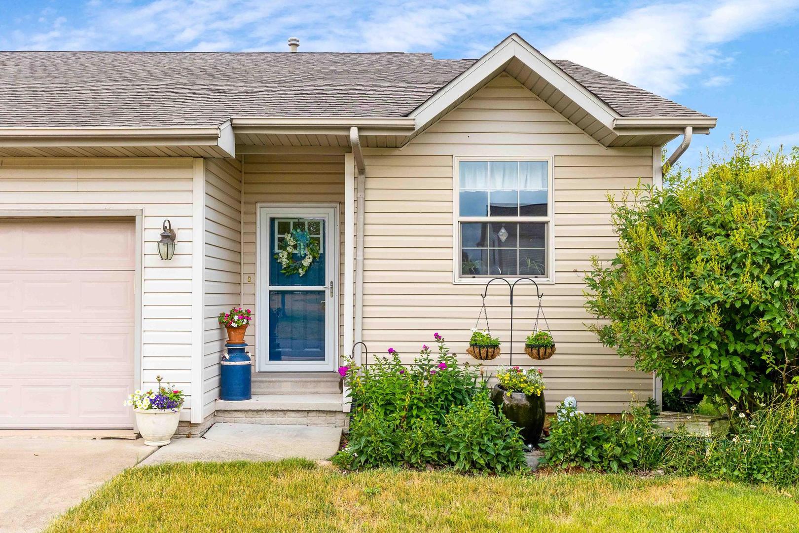107 Labrador Lane Downs, IL 61736 - Photo 2 of 35 a house view with a outdoor space