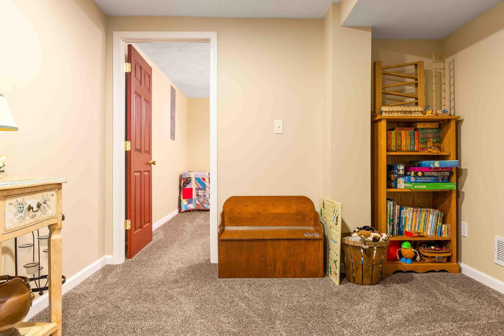 107 Labrador Lane Downs, IL 61736 - Photo 27 of 35 a living room with furniture and a baby crib