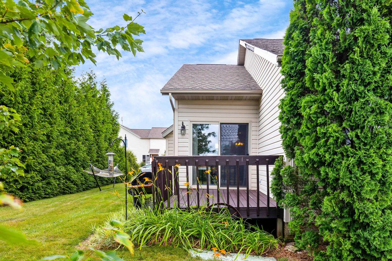 107 Labrador Lane Downs, IL 61736 - Photo 28 of 35 a view of a house with a yard and sitting area