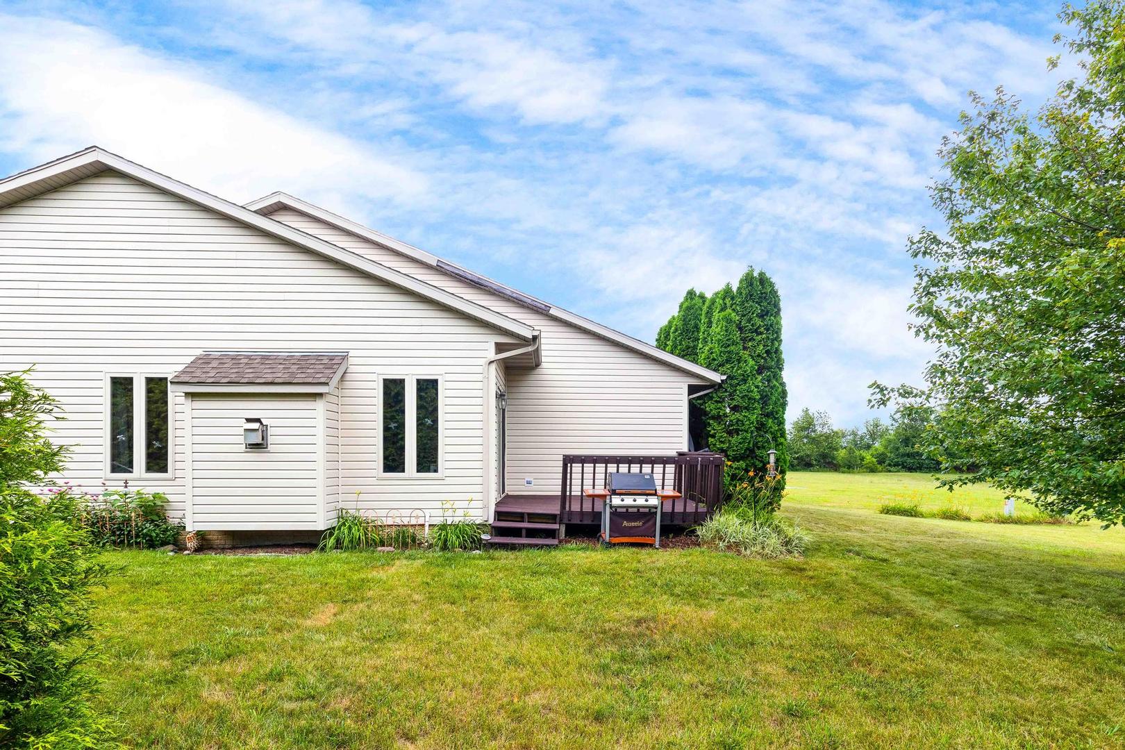 107 Labrador Lane Downs, IL 61736 - Photo 30 of 35 a view of a house with backyard and garden