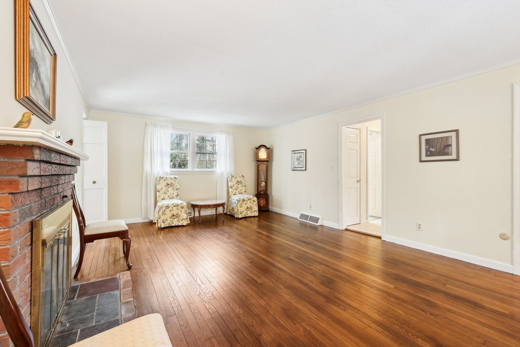 17 Wedgewood Road Stow, MA 01775 - Photo 4 of 31 a view of empty room with wooden floor and fan