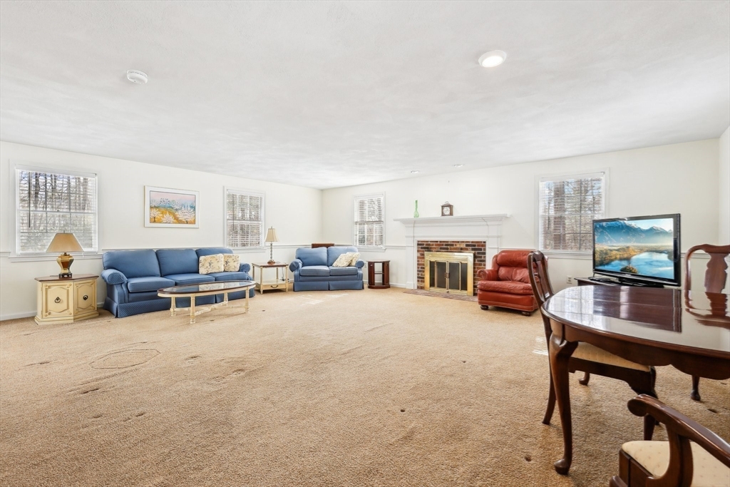 17 Wedgewood Road Stow, MA 01775 - Photo 6 of 31 a living room with furniture and a flat screen tv
