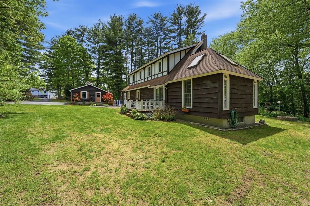 43 Flint Road Tyngsborough, MA 01879 - Photo 33 of 40 a view of a house with a yard and sitting area